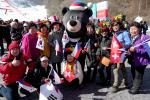 a group of people with the PyeongChang 2018 mascot Bandabi