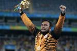 Gold medalist Muhammad Ziyad Zolkefli of Malaysia celebrate on the podium at the medal ceremony for the Men's Shot Put F20 Final at the Rio 2016 Paralympic Games.