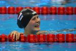 a female Para swimmer smiles in the pool