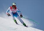 a male standing Para alpine skier in action