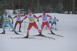 Two vision impaired cross-country skiers race with their guides