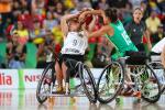 female wheelchair basketball player Laura Fuerst fighting with another player for the ball