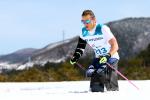 female Nordic skier Oksana Masters competess on the snow