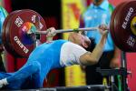 male powerlifter Pia Laophakdee kisses the bar