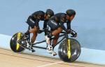 male Para cyclist Muhammad Afiq Afify Rizan and his guide riding on a tandem bike on the track