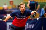 male Para table tennis player Peter Rosenmeier plays a forehand