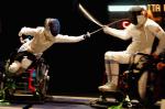 two female wheelchair fencers on the piste