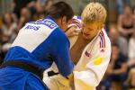 male judoka Chris Skelley wrestles with another fighter 