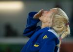 female judoka Yuliya Halinska blows a kiss to the sky