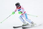 female Para alpine skier Danelle Umstead skis through a gate