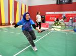 Female Para badminton player practices during workshop in UAE