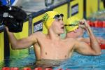 male Para swimmer Timothy Hodge fistpumps after winning a race