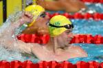 male Para swimmer Timothy Disken punches the water with happiness after winning a race