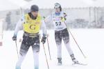 female Para Nordic skier Clara Klug skis towards the finish line behind her guide