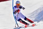 female Para alpine skier Marie Bochet turns through a gate