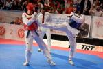 male Para taekwondo fighter Juan Diego Garcia Lopez kicks another fighter in the chest