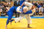 male judoka Ramil Gasimov wrestles another judoka to the ground