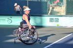 Wheelchair tennis player Jordanne Whiley about to hit the ball