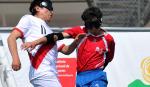 Peruvian and Chilean blind football players fight for the ball