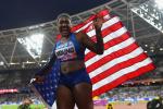 Deja Young laughs while waiving the US flag