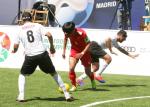 Chinese blind football player Wei Jiansen dribbles past one Moroccan defender and prepares to shoot