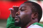 Nigerian powerlifter Paul Kehinde salutes the flag