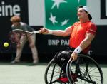 Argentinian wheelchair tennis player Gustavo Fernandez hits a forehand