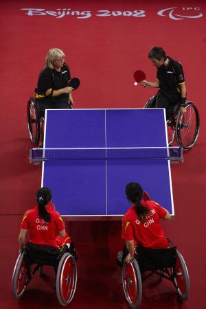 Athletes practicing table tennis