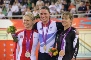 A picture of 3 womens on a podium