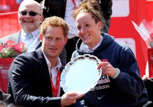 Prince Harry presents Tatyana McFadden with her 2013 London Marathon trophy