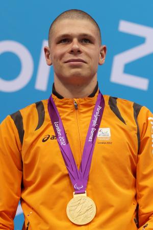 A picture of a man with a gold medal around his neck