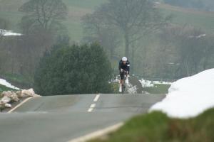 Sarah Storey on bike in snowy countryside