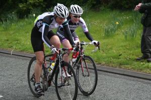 2 athletes cycling during a race