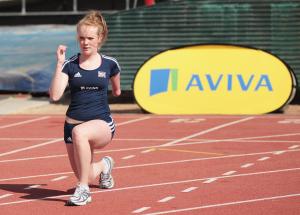 A picture of a girl who is training on an athletic field