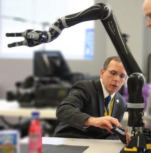Man working with a robot arm