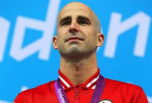 A picture of a man during a medal ceremony