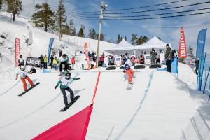Lisa Bunschoten (bib No. 7) leads the way in the first ever women's four-by-four snowboard-cross race