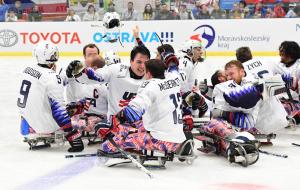 A group of USA Para ice hockey players celebrating