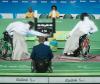 Athletes practicing wheelchair fencing.